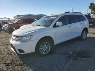 2015 Dodge Journey SXT with VIN 3C4PDCBG4FT742833, listed as a Copart auction lot 82214135 with 124,968 mi miles and Clean title. Bid and sale history available at DreamBid. Image 1.