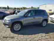 2014 Volkswagen Tiguan SEL with VIN WVGAV3AX8EW585929, listed as a Copart auction lot 61462205 with 63,899 mi miles and Salvage title. Bid and sale history available at DreamBid. Image 1.