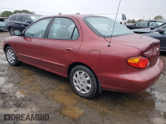 1999 Hyundai Elantra GL с VIN KMHJF25F2XU878071, выставлен на аукционе Copart как лот 80333494 с пробегом 86 960 миль миль и Списание • Salvage title. История ставок и продаж доступна на DreamBid. Изображение 2.