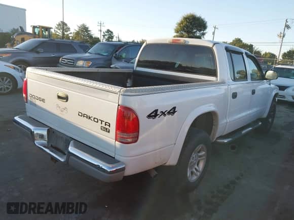 2003 Dodge Dakota with VIN 1D7HG48X13S259876, listed as a IAAI auction lot 43448159 with 197,823 mi miles and . Bid and sale history available at DreamBid. Image 4.