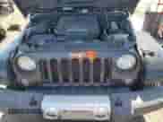 2014 Jeep Wrangler Sahara z VIN 1C4AJWBG4EL196867, wystawiony jako Copart lot #71590205 z przebiegiem 121 968 mil mil oraz Szkoda całkowita • Salvage title. Historia ofert i sprzedaży dostępna na DreamBid. Obrazek 11.