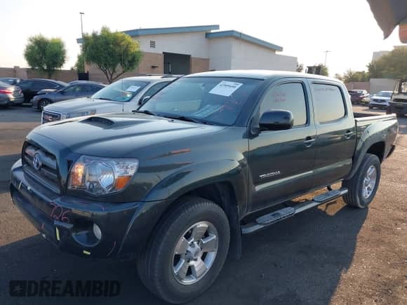 2010 Toyota Tacoma PreRunner with VIN 3TMJU4GN0AM092047, listed as a IAAI auction lot 42909450 with 180,192 mi miles and . Bid and sale history available at DreamBid. Image 2.