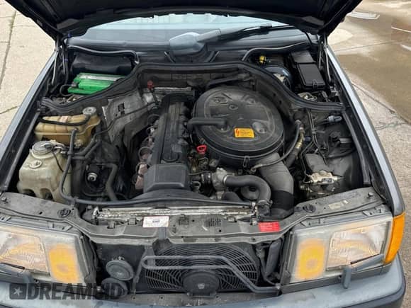 1989 Mercedes-Benz 300 E with VIN WDBEA30D2KB022367, listed as a Copart auction lot 60087495 with 76,930 mi miles and Clean title. Bid and sale history available at DreamBid. Image 7.