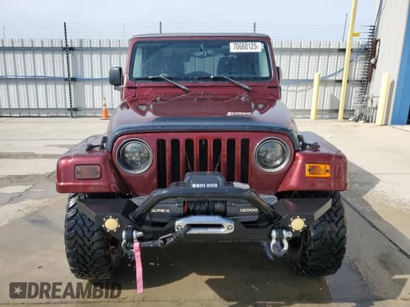 2003 Jeep Wrangler Sahara с VIN 1J4FA59S53P310062, выставлен на аукционе Copart как лот 70660125 с пробегом 196 984 миль миль и Списание • Salvage title. История ставок и продаж доступна на DreamBid. Изображение 5.