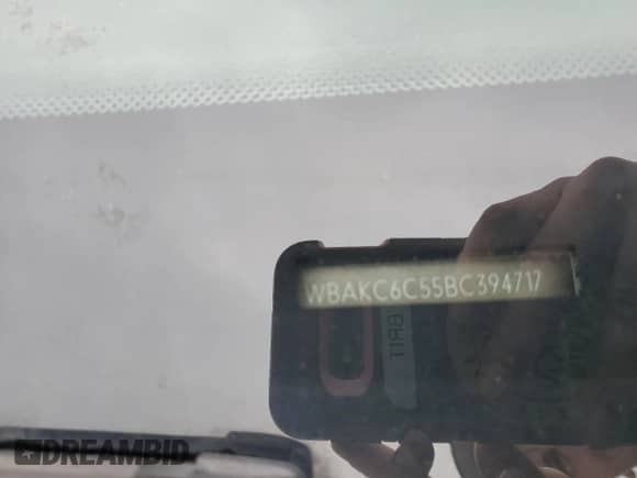 2011 BMW 7 Series 750i xDrive with VIN WBAKC6C55BC394717, listed as a Copart auction lot 59570605 with Not provided miles and Salvage title. Bid and sale history available at DreamBid. Image 12.