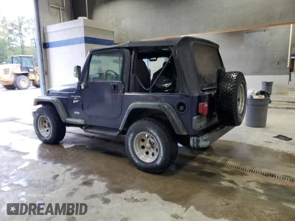1997 Jeep Wrangler Sport with VIN 1J4FY19S2VP451677, listed as a Copart auction lot 80634555 with 137,374 mi miles and Clean title. Bid and sale history available at DreamBid. Image 2.