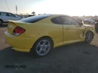 2006 Hyundai Tiburon GT с VIN KMHHN65FX6U202815, выставлен на аукционе Copart как лот 88673255 с пробегом Не указан миль и Списание • Salvage title. История ставок и продаж доступна на DreamBid. Изображение 3.