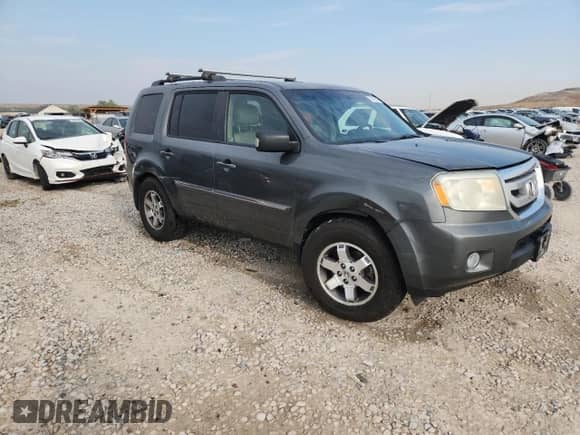 2009 Honda Pilot Touring with VIN 5FNYF48969B025883, listed as a Copart auction lot 70923065 with 192,552 mi miles and Salvage title. Bid and sale history available at DreamBid. Image 4.