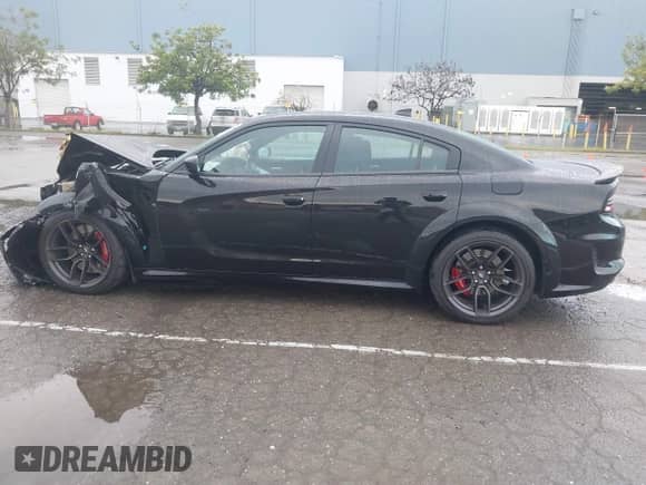 2021 Dodge Charger Scat Pack Widebody with VIN 2C3CDXGJ9MH561070, listed as a IAAI auction lot 41798863 with 62,984 mi miles and . Bid and sale history available at DreamBid. Image 15.