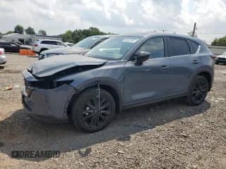 2025 Mazda CX-5 S Carbon Edition z VIN JM3KFBCMXS0655066, wystawiony jako Copart lot #66453165 z przebiegiem 1 559 mil mil oraz Szkoda całkowita • Salvage title. Historia ofert i sprzedaży dostępna na DreamBid. Obrazek 1.