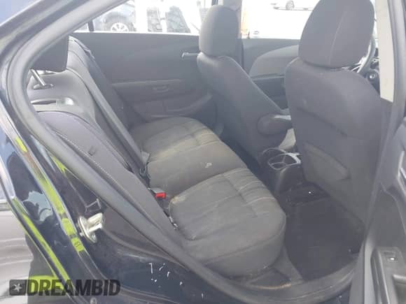 2014 Chevrolet Sonic LT z VIN 1G1JC5SH7E4137635, wystawiony jako IAAI lot #43083539 z przebiegiem 176 334 mil mil oraz . Historia ofert i sprzedaży dostępna na DreamBid. Obrazek 8.