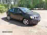 2013 Chevrolet Sonic LTZ with VIN 1G1JE5SH4D4113866, listed as a IAAI auction lot 42153781 with 130,122 mi miles and . Bid and sale history available at DreamBid. Image 1.