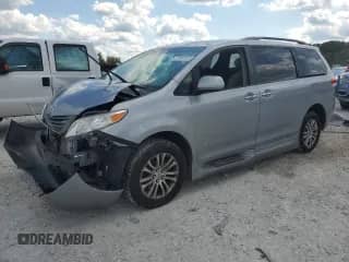 2012 Toyota Sienna XLE with VIN 5TDYK3DC6CS235796, listed as a Copart auction lot 70565525 with 120,990 mi miles and Clean title. Bid and sale history available at DreamBid. Image 1.
