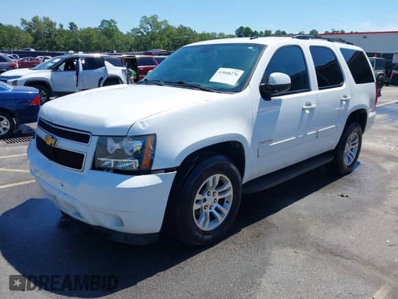 2014 Chevrolet Tahoe LS with VIN 1GNSCAE01ER191744, listed as a IAAI auction lot 43068276 with 275,886 mi miles and . Bid and sale history available at DreamBid. Image 2.