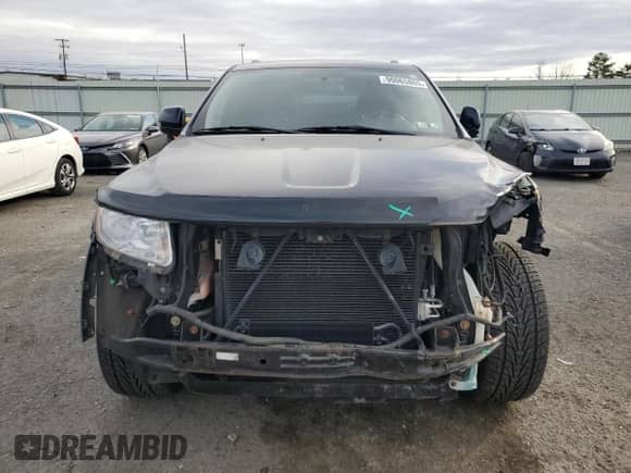 2012 Jeep Grand Cherokee Laredo with VIN 1C4RJFAGXCC272254, listed as a Copart auction lot 90065865 with 69,373 mi miles and Salvage title. Bid and sale history available at DreamBid. Image 5.