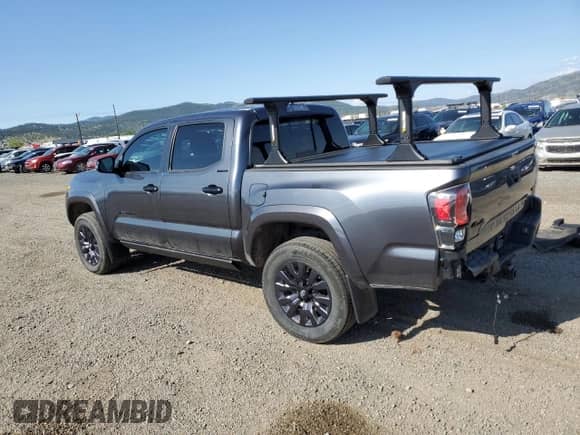 2021 Toyota Tacoma Limited with VIN 3TMGZ5AN1MM423670, listed as a Copart auction lot 56051035 with 62,699 mi miles and Salvage title. Bid and sale history available at DreamBid. Image 2.