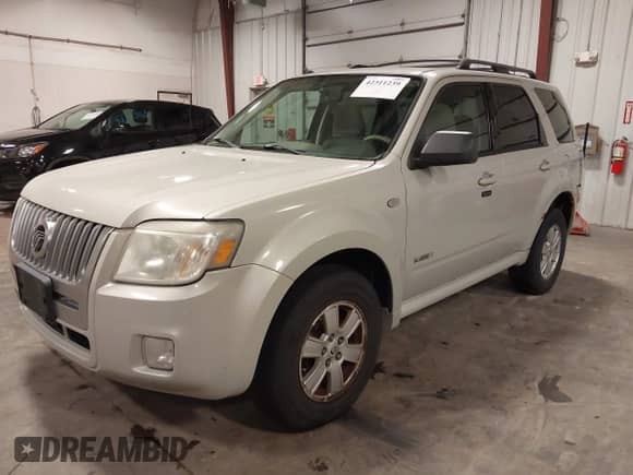 2008 Mercury Mariner with VIN 4M2CU91148KJ42603, listed as a IAAI auction lot 42311239 with 173,554 mi miles and . Bid and sale history available at DreamBid. Image 2.