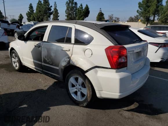 2010 Dodge Caliber SXT with VIN 1B3CB4HA3AD595658, listed as a Copart auction lot 85376495 with 209,626 mi miles and Salvage title. Bid and sale history available at DreamBid. Image 2.