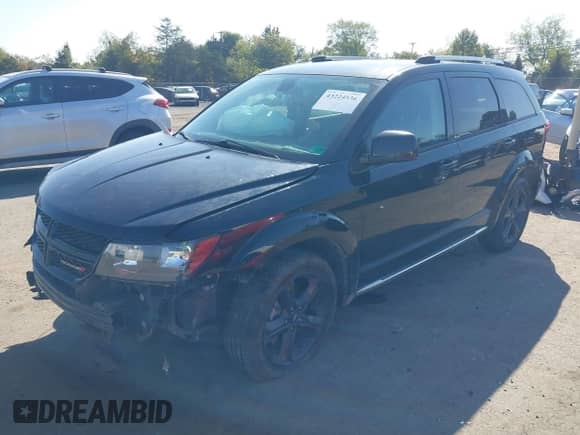 2019 Dodge Journey Crossroad with VIN 3C4PDCGG7KT815518, listed as a IAAI auction lot 43224536 with 97,784 mi miles and . Bid and sale history available at DreamBid. Image 2.