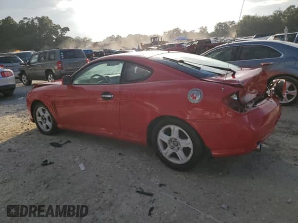 2003 Hyundai Tiburon с VIN KMHHM65D43U038524, выставлен на аукционе Copart как лот 80569804 с пробегом 175 248 миль миль и Списание • Salvage title. История ставок и продаж доступна на DreamBid. Изображение 2.