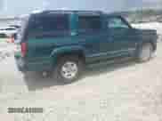 2000 Chevrolet Tahoe Z71 с VIN 1GNEK13R8YR126606, выставлен на аукционе Copart как лот 64043135 с пробегом 284 964 миль миль и Списание • Salvage title. История ставок и продаж доступна на DreamBid. Изображение 3.