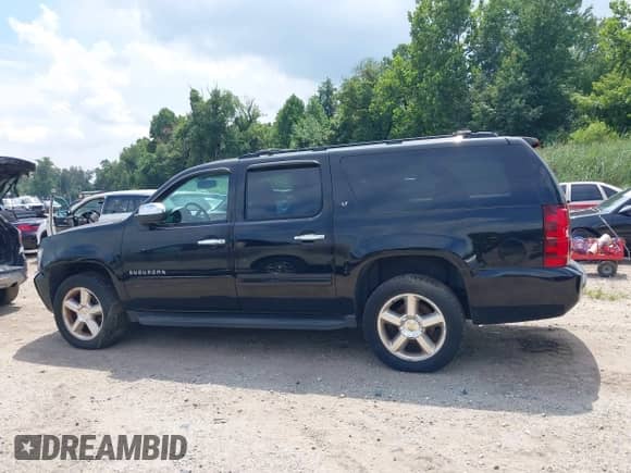 2012 Chevrolet Suburban LT z VIN 1GNSKJE7XCR117879, wystawiony jako IAAI lot #43005567 z przebiegiem 166 242 mil mil oraz . Historia ofert i sprzedaży dostępna na DreamBid. Obrazek 14.