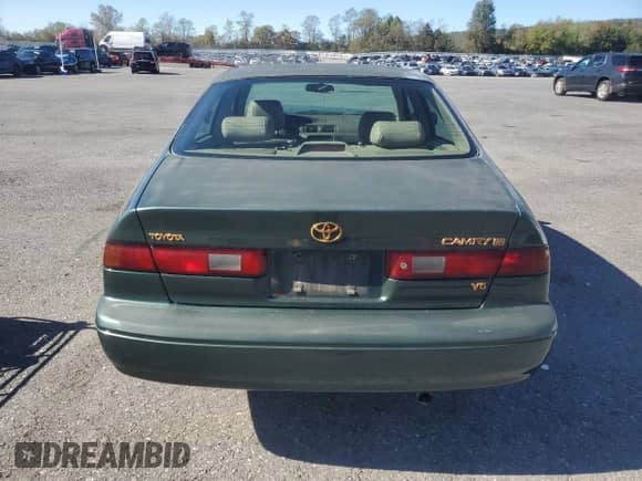 1999 Toyota Camry XLE with VIN JT2BF28K6X0222909, listed as a Copart auction lot 86658125 with 187,757 mi miles and Salvage title. Bid and sale history available at DreamBid. Image 6.