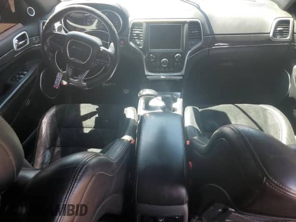 2014 Jeep Grand Cherokee SRT-8 z VIN 1C4RJFDJ4EC202579, wystawiony jako Copart lot #62811605 z przebiegiem 83 024 mil mil oraz Szkoda całkowita • Salvage title. Historia ofert i sprzedaży dostępna na DreamBid. Obrazek 8.