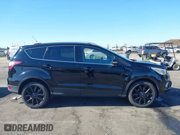 2017 Ford Escape Titanium with VIN 1FMCU0JD6HUE90933, listed as a IAAI auction lot 43035309 with 76,661 mi miles and . Bid and sale history available at DreamBid. Image 14.