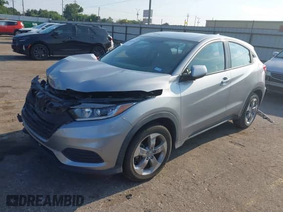 2021 Honda HR-V LX with VIN 3CZRU5H31MM729970, listed as a IAAI auction lot 43037426 with 102,011 mi miles and . Bid and sale history available at DreamBid. Image 2.