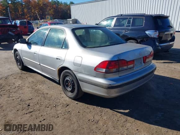 2002 Honda Accord LX with VIN JHMCG56482C010016, listed as a IAAI auction lot 43534866 with 250,325 mi miles and . Bid and sale history available at DreamBid. Image 3.