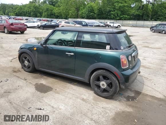 2007 MINI Hardtop with VIN WMWMF33537TL77985, listed as a Copart auction lot 61908635 with 180,470 mi miles and Salvage title. Bid and sale history available at DreamBid. Image 2.