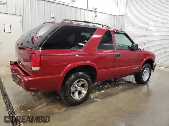 2001 Chevrolet Blazer LS z VIN 1GNCS18W11K234697, wystawiony jako Copart lot #61261065 z przebiegiem 124 925 mil mil oraz Czysty tytuł • Clean title. Historia ofert i sprzedaży dostępna na DreamBid. Obrazek 3.