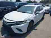 2018 Toyota Camry SE with VIN 4T1B11HK8JU026420, listed as a IAAI auction lot 43038626 with 114,080 mi miles and . Bid and sale history available at DreamBid. Image 2.