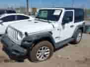 2023 Jeep Wrangler Sport S with VIN 1C4GJXAN4PW656756, listed as a IAAI auction lot 42328385 with 21,698 mi miles and . Bid and sale history available at DreamBid. Image 2.