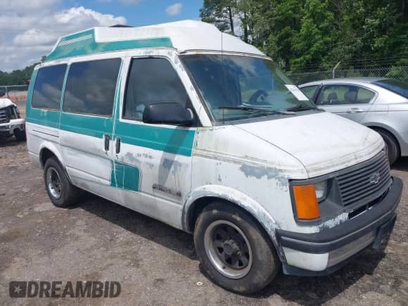1991 Chevrolet Astro Cargo z VIN 1GBDM19Z7MB202913, wystawiony jako IAAI lot #42363530 z przebiegiem 191 695 mil mil oraz . Historia ofert i sprzedaży dostępna na DreamBid. Obrazek 1.