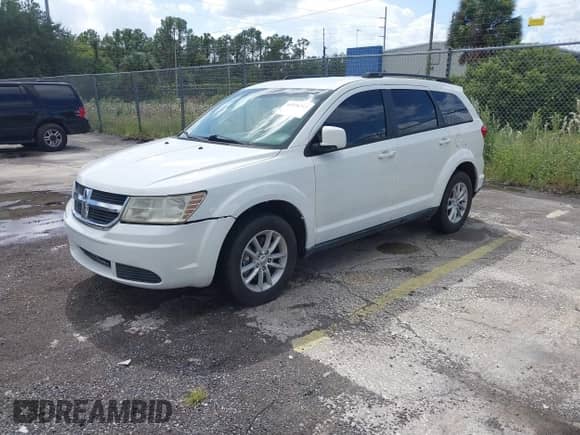 2015 Dodge Journey SXT with VIN 3C4PDDBGXFT606731, listed as a IAAI auction lot 43376713 with 124,087 mi miles and . Bid and sale history available at DreamBid. Image 2.