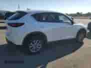 2023 Mazda CX-5 S Preferred z VIN JM3KFBCM1P0243111, wystawiony jako Copart lot #80721845 z przebiegiem 19 891 mil mil oraz Szkoda całkowita • Salvage title. Historia ofert i sprzedaży dostępna na DreamBid. Obrazek 3.