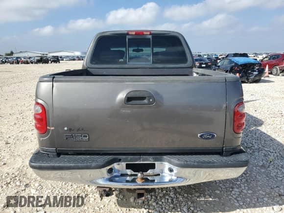 2002 Ford F-150 XLT с VIN 1FTRW07L42KE28490, выставлен на аукционе Copart как лот 90126215 с пробегом 289 777 миль миль и Списание • Salvage title. История ставок и продаж доступна на DreamBid. Изображение 6.