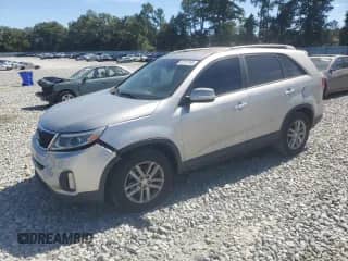 2014 Kia Sorento LX with VIN 5XYKT3A65EG469994, listed as a Copart auction lot 82197165 with 134,674 mi miles and Salvage title. Bid and sale history available at DreamBid. Image 1.