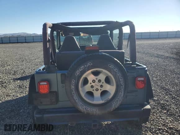 1999 Jeep Wrangler Sport with VIN 1J4FY19S1XP455674, listed as a Copart auction lot 86821605 with 218,356 mi miles and Clean title. Bid and sale history available at DreamBid. Image 6.