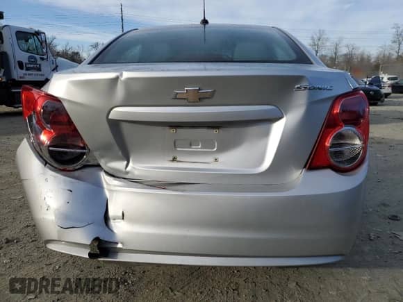 2015 Chevrolet Sonic LS с VIN 1G1JA5SG5F4216915, выставлен на аукционе Copart как лот 48220755 с пробегом 139 027 миль миль и Списание • Salvage title. История ставок и продаж доступна на DreamBid. Изображение 6.