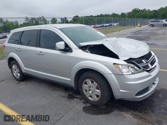 2012 Dodge Journey SE z VIN 3C4PDCAB0CT366925, wystawiony jako IAAI lot #42346803 z przebiegiem 316 176 mil mil oraz . Historia ofert i sprzedaży dostępna na DreamBid. Obrazek 1.