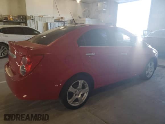 2013 Chevrolet Sonic LTZ с VIN 1G1JE5SG0D4164711, выставлен на аукционе Copart как лот 81845895 с пробегом 136 844 миль миль и Списание • Salvage title. История ставок и продаж доступна на DreamBid. Изображение 3.