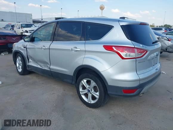 2014 Ford Escape SE z VIN 1FMCU0GX5EUA21457, wystawiony jako IAAI lot #43370908 z przebiegiem 143 709 mil mil oraz . Historia ofert i sprzedaży dostępna na DreamBid. Obrazek 3.
