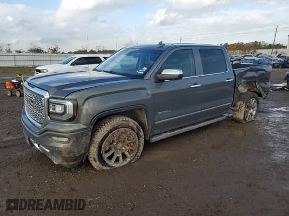 2017 GMC Sierra 1500 Denali with VIN 3GTP1PEJ8HG287682, listed as a Copart auction lot 84727334 with 143,711 mi miles and Salvage title. Bid and sale history available at DreamBid. Image 1.