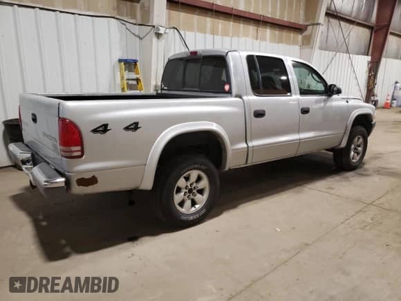 2003 Dodge Dakota Sport with VIN 1D7HG38X83S300059, listed as a Copart auction lot 61420305 with 230,971 mi miles and Salvage title. Bid and sale history available at DreamBid. Image 3.