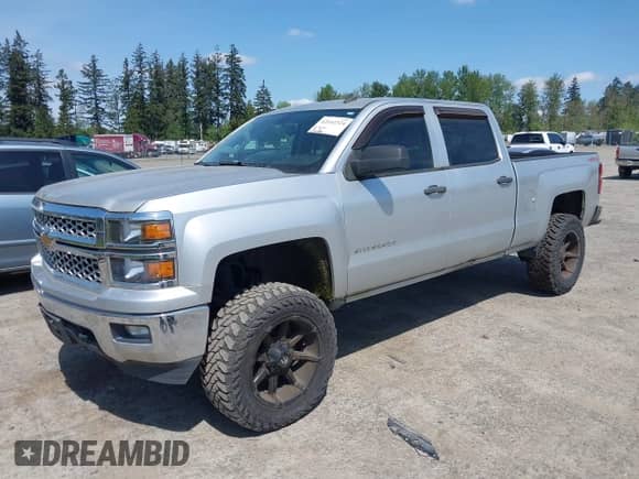 2014 Chevrolet Silverado 1500 LT with VIN 3GCUKREH0EG399090, listed as a IAAI auction lot 42142324 with 104,226 mi miles and . Bid and sale history available at DreamBid. Image 2.