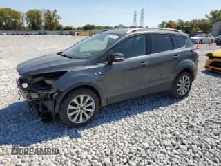 2017 Ford Escape Titanium с VIN 1FMCU9JDXHUD75370, выставлен на аукционе Copart как лот 80217015 с пробегом 145 360 миль миль и Списание • Salvage title. История ставок и продаж доступна на DreamBid. Изображение 1.