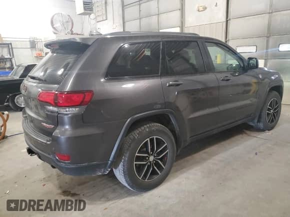 2018 Jeep Grand Cherokee Trailhawk с VIN 1C4RJFLG2JC227951, выставлен на аукционе Copart как лот 81715465 с пробегом 128 266 миль миль и Списание • Salvage title. История ставок и продаж доступна на DreamBid. Изображение 3.